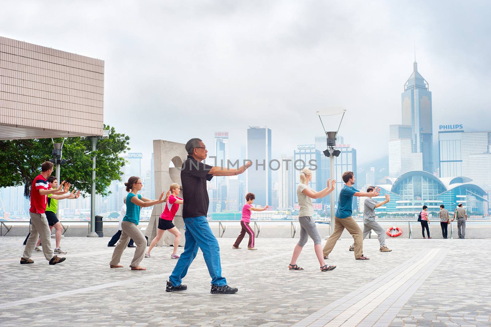 Hong Kong S.A.R. - May 15, 2013: Tai Chi Public Exercising in early morning  in Hong Kong. With a land of 1,104 km and population of 7 million, Hong Kong is one of the most densely populated areas in the world