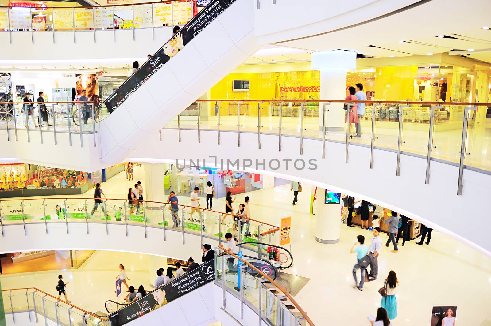 Bangkok, Thailand - March 04, 2013: People at Central World shopping plaza  in Bangkok. It's the third largest shopping complex in the world. Central World has 550,000 square metres of shopping mall