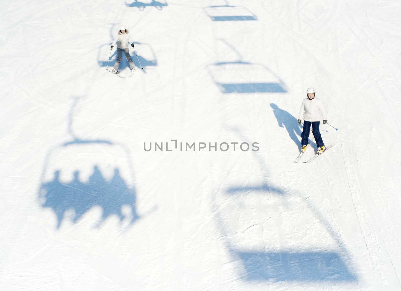 Bukovel, Ukraine - December 13, 2013: Skiers on a slope in Bukovel, Ukraine. Bukovel - is the largest ski resort in Ukraine. In 2012 it was named the most fast growing world ski resort.