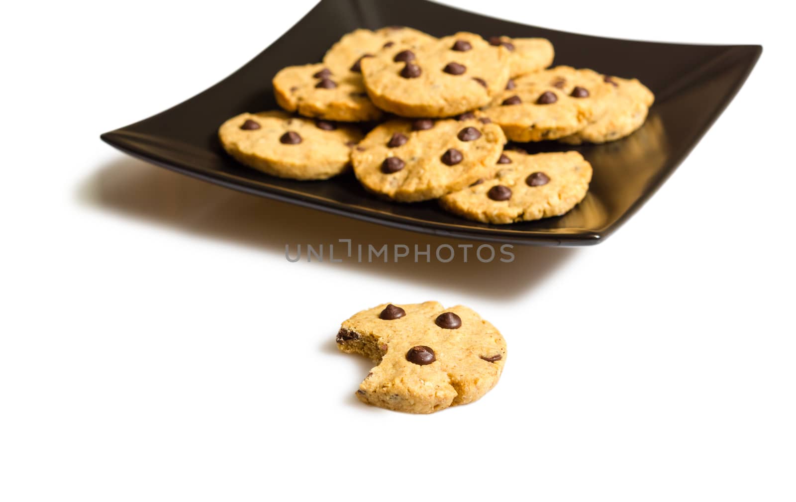 Chocolate chip cookies on a black plate by doble.d