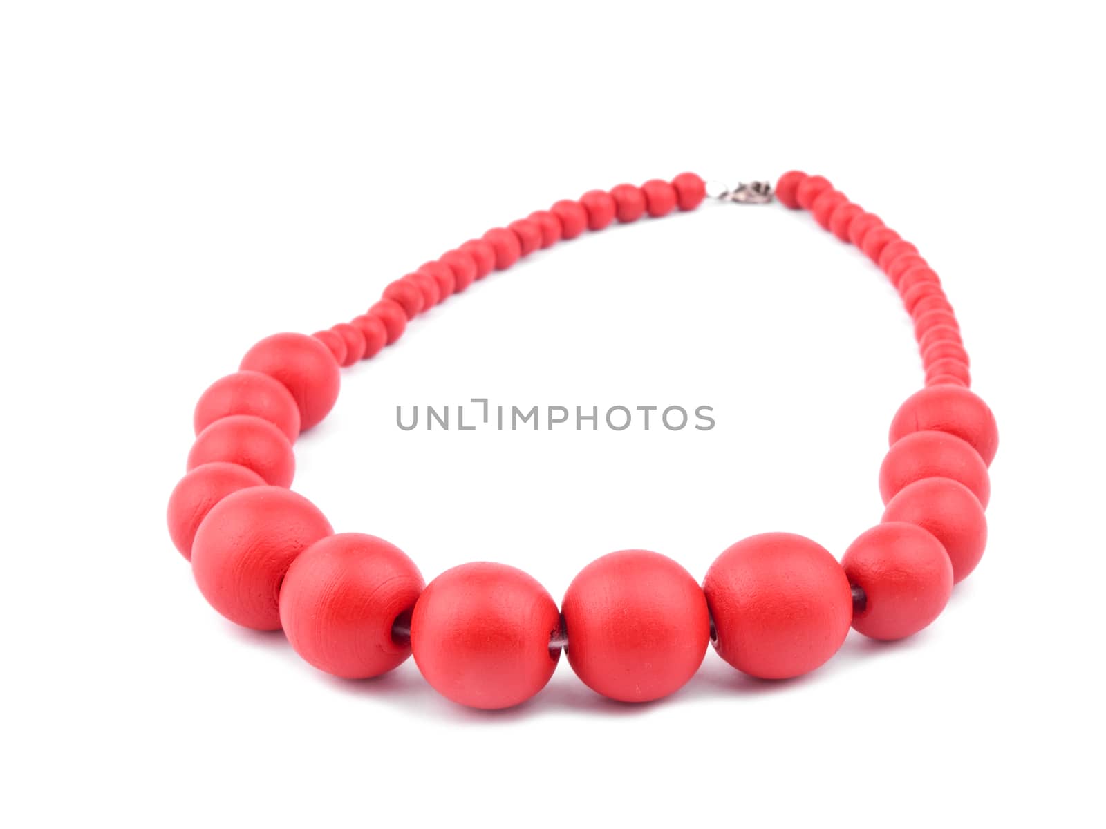 Necklace made from red wooden beads on white background