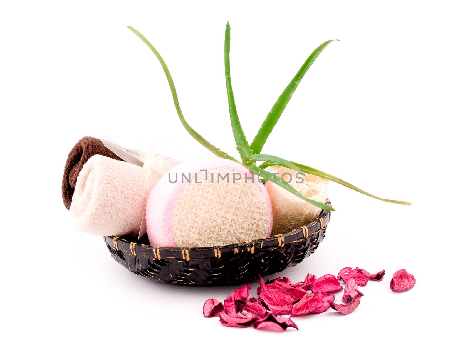 Bath and spa accessories in black basket on white background