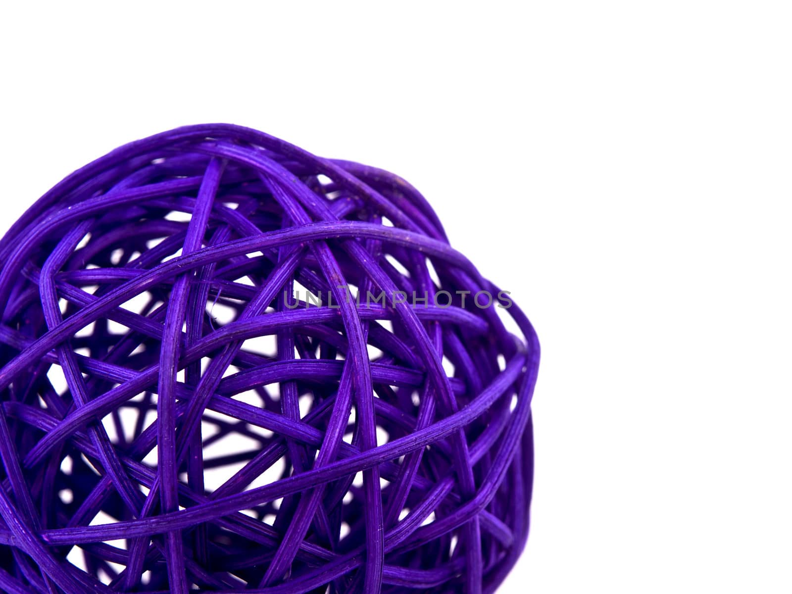 Closeup picture of purple rattan ball on white background with empty space for your text