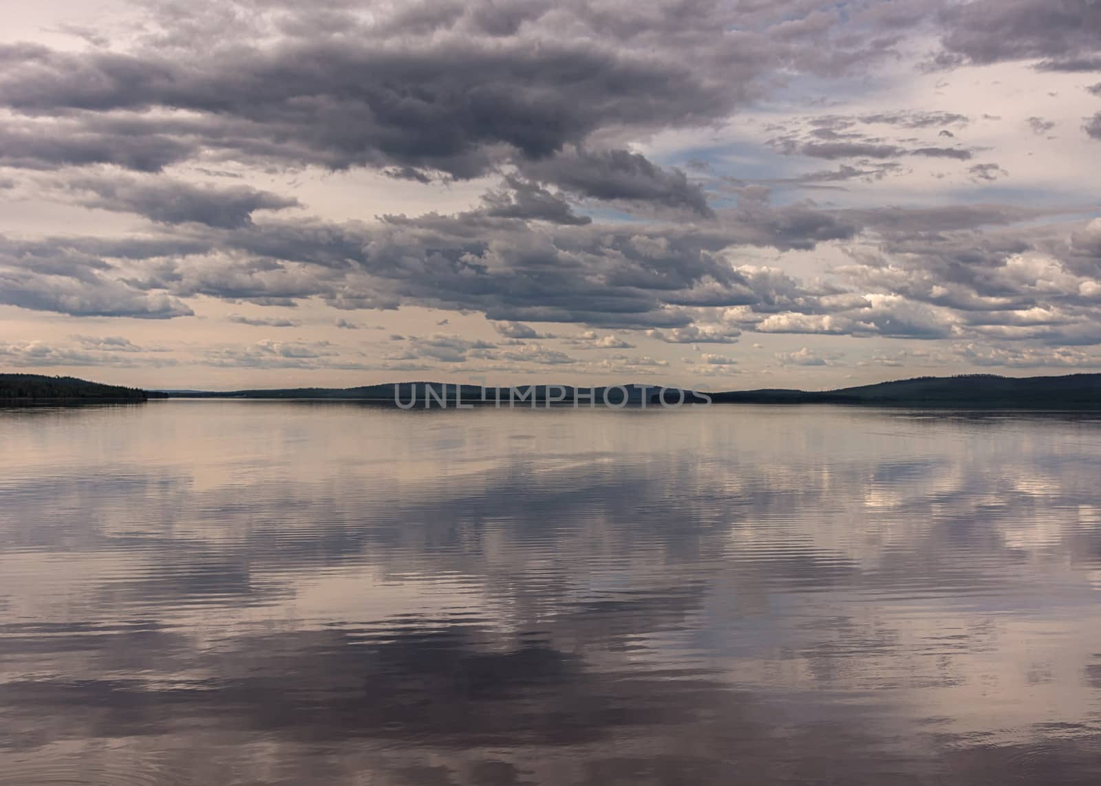 Menacing scaring skies over lake in Southwest Lapland, Finland,  by Claudine