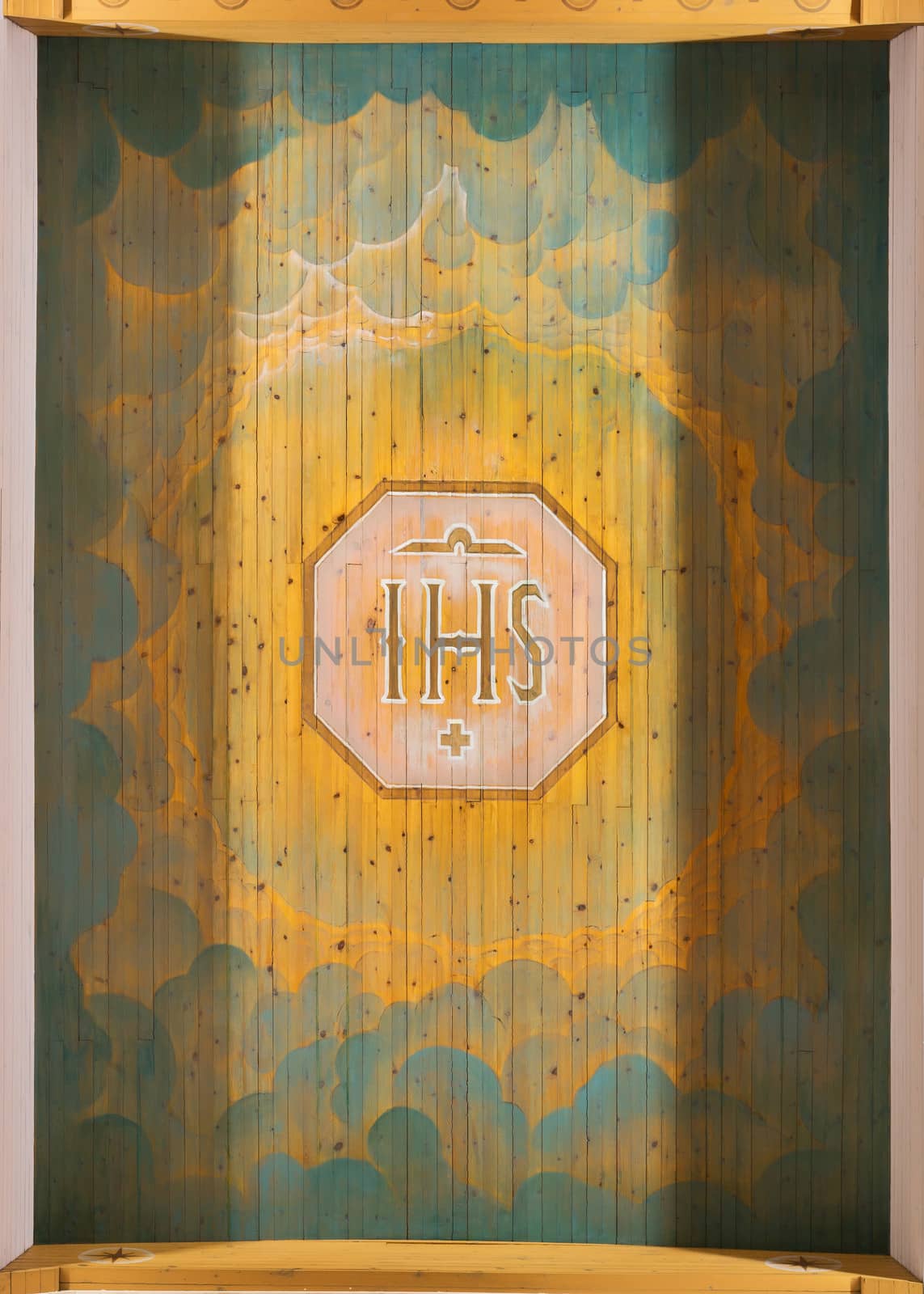 The first three letters of the Greek spelling of the Holy Name of Jesus as painted on the ceiling of Rovaniemi Church in Lapland.