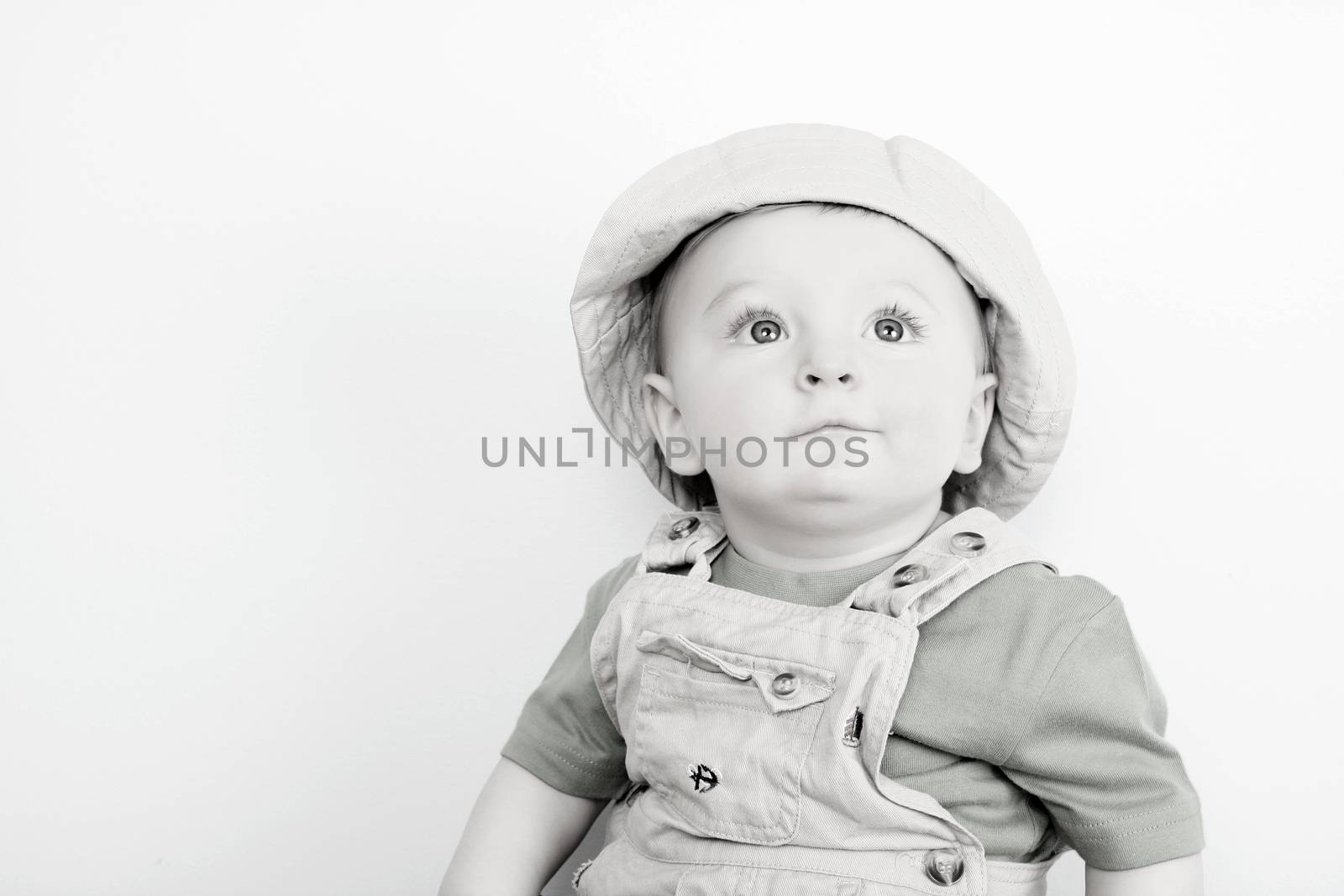Cute caucasian baby boy wearing a hat