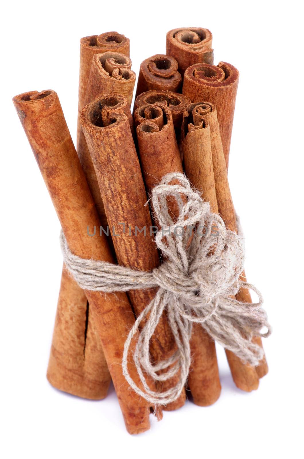 Bunch of Cinnamon Sticks with Sewing Threads isolated on white background