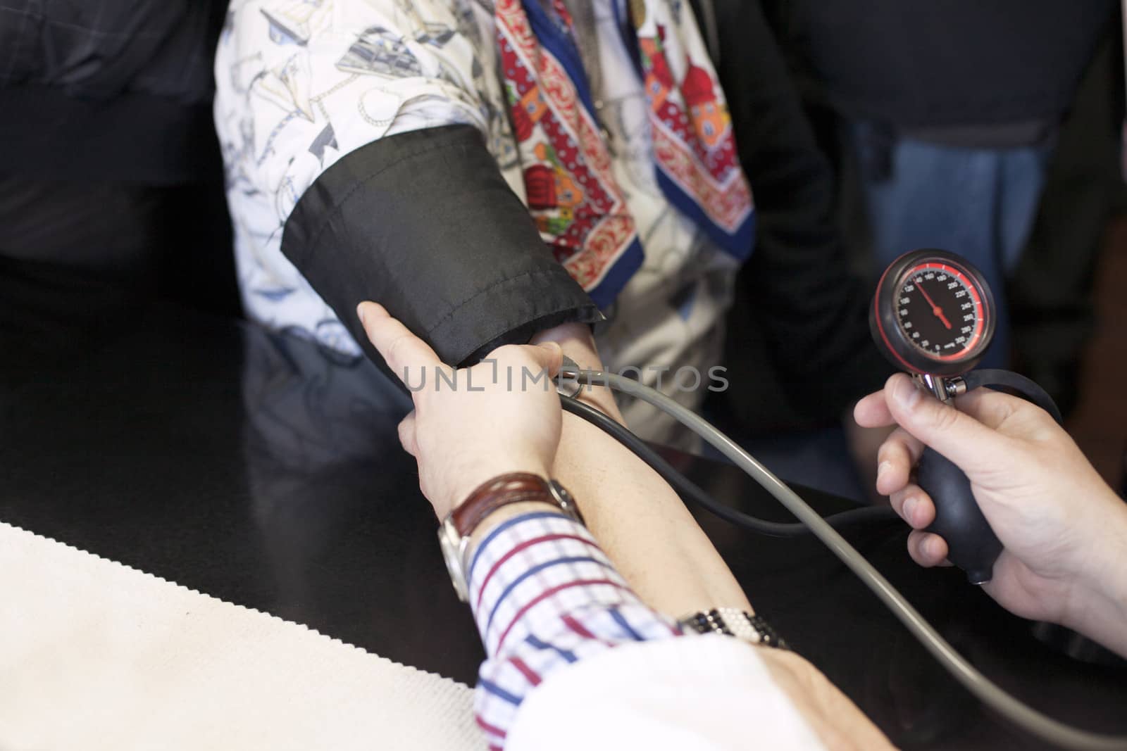checking blood pressure  by wellphoto
