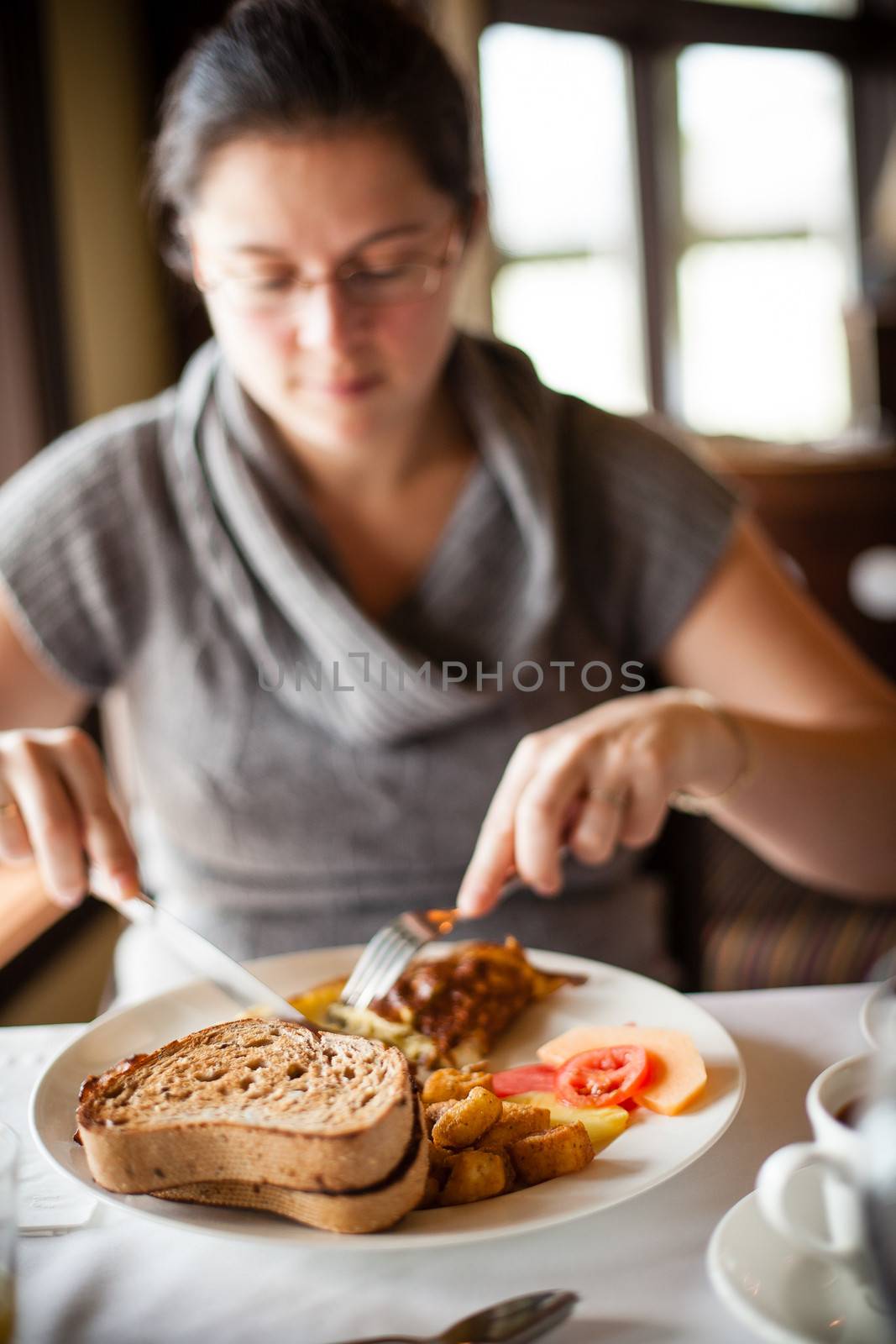 woman eating breakfast by Talanis