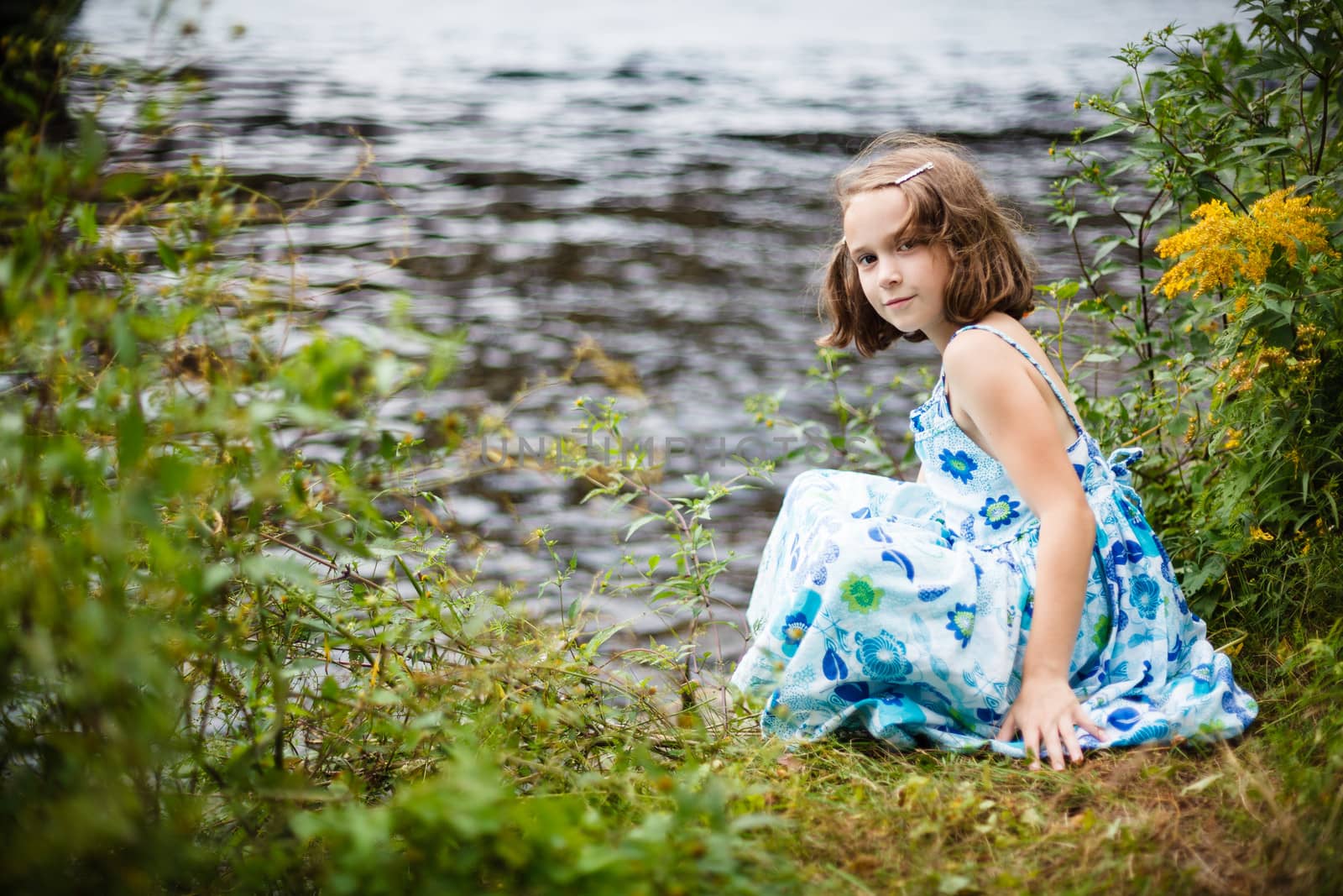 Girl playing near the water by Talanis