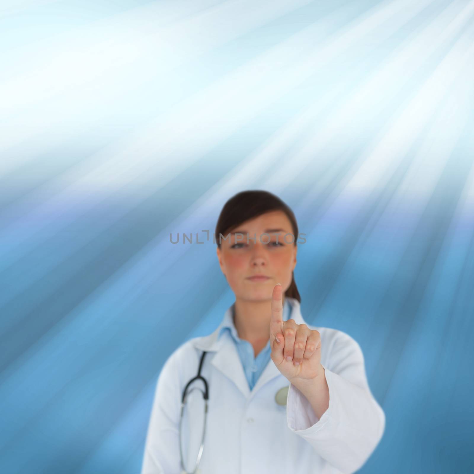 Young brunette doctor pointing by Wavebreakmedia