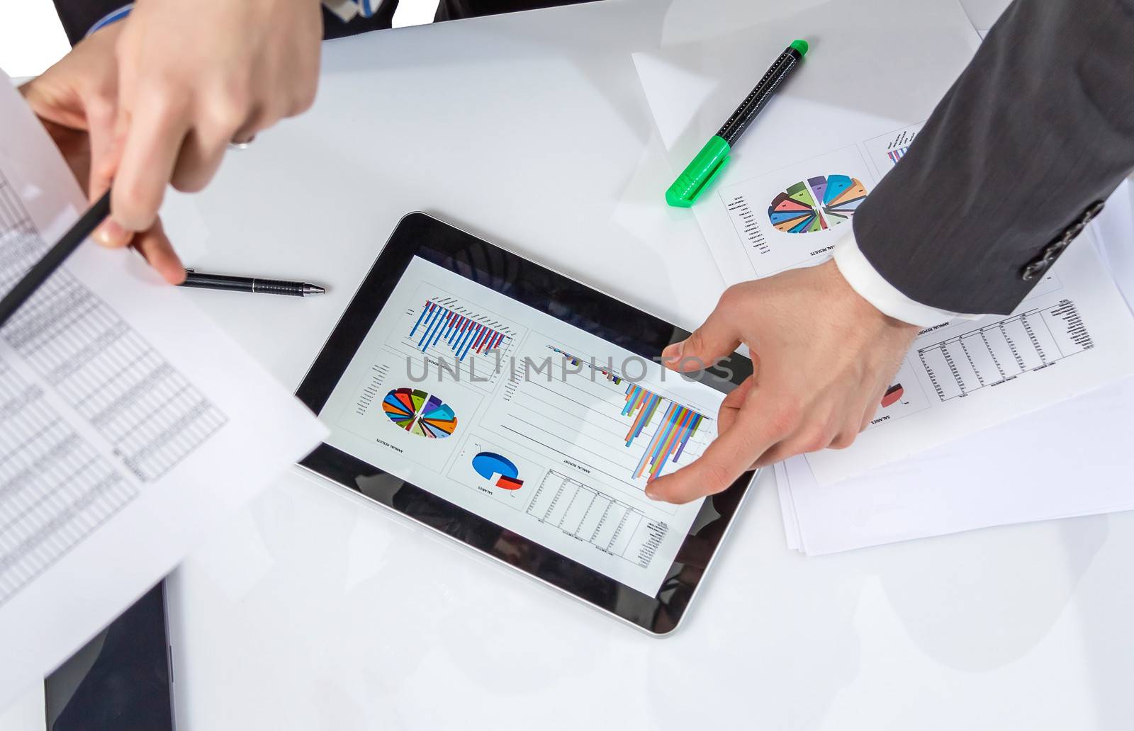 Business people analyzing financial charts and documents in a meeting for the success of company