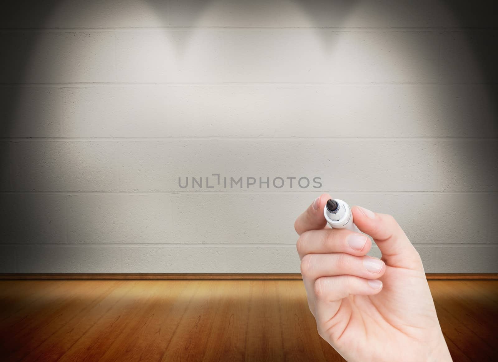Composite image of female hand holding black whiteboard marker in bright room