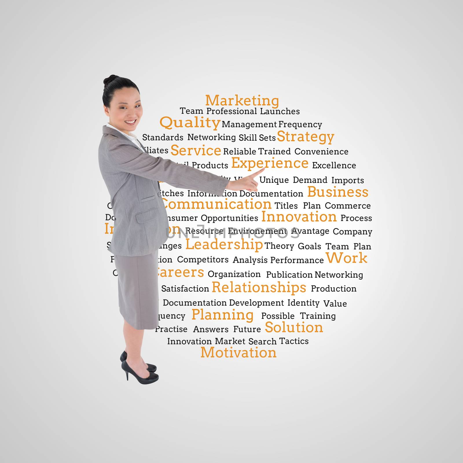 Composite image of asian businesswoman pointing by Wavebreakmedia