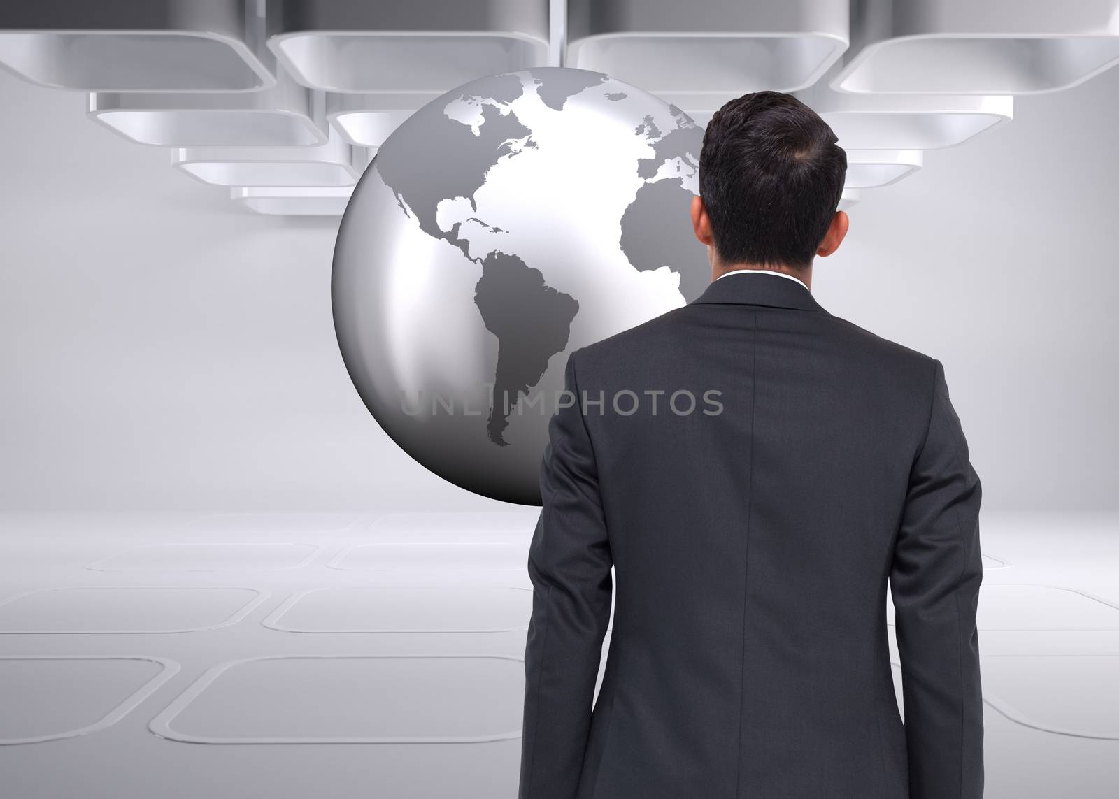 Composite image of businessman looking at planet  by Wavebreakmedia