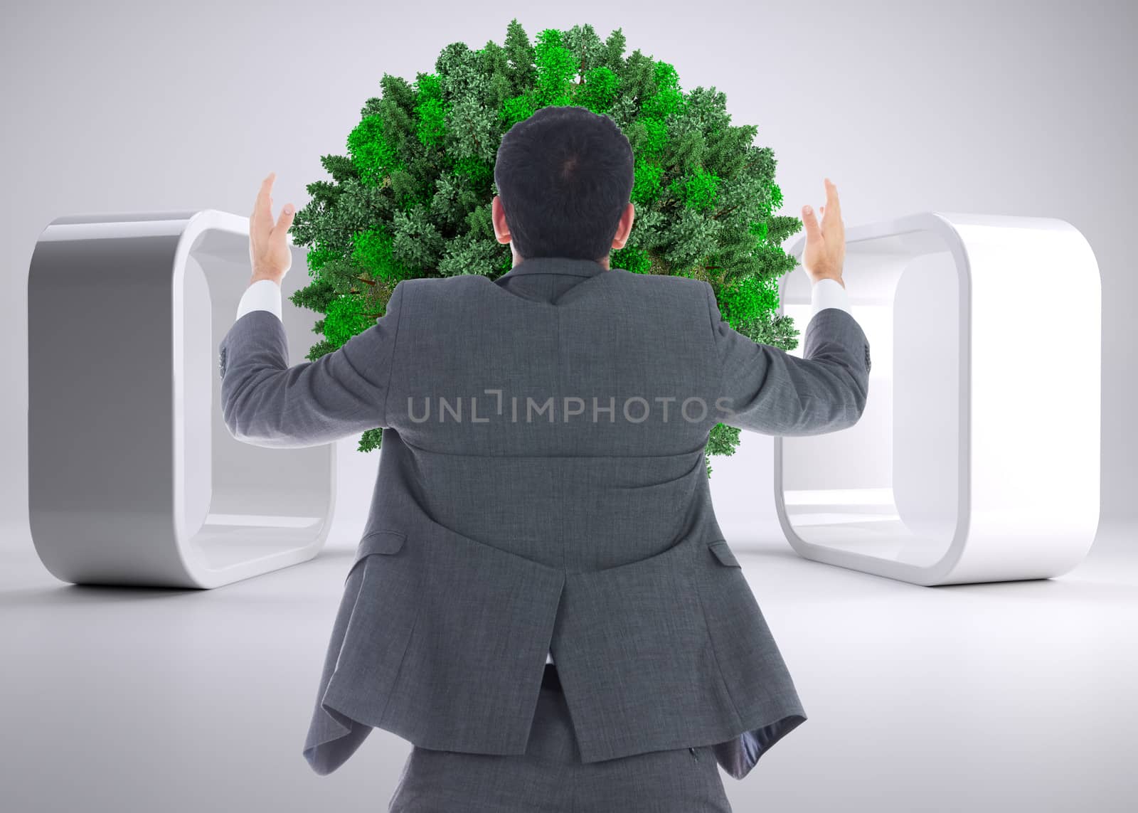 Composite image of businessman with arms raised