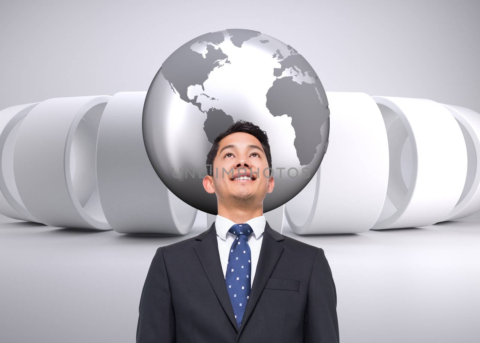 Composite image of businessman against planet on grey abstract background