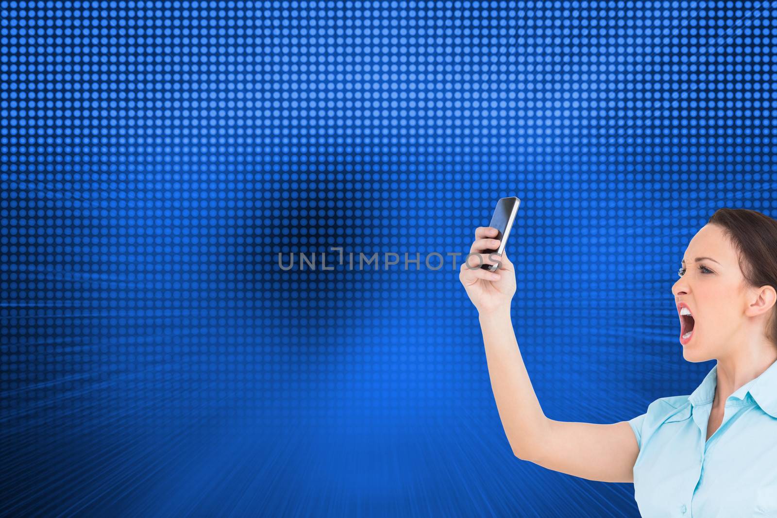 Composite image of angry businesswoman yelling at her smartphone by Wavebreakmedia