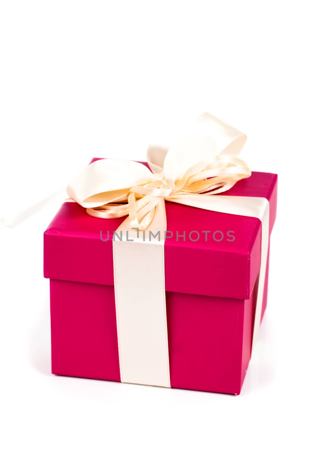 red gift box with ribbon bow isolated on white by motorolka