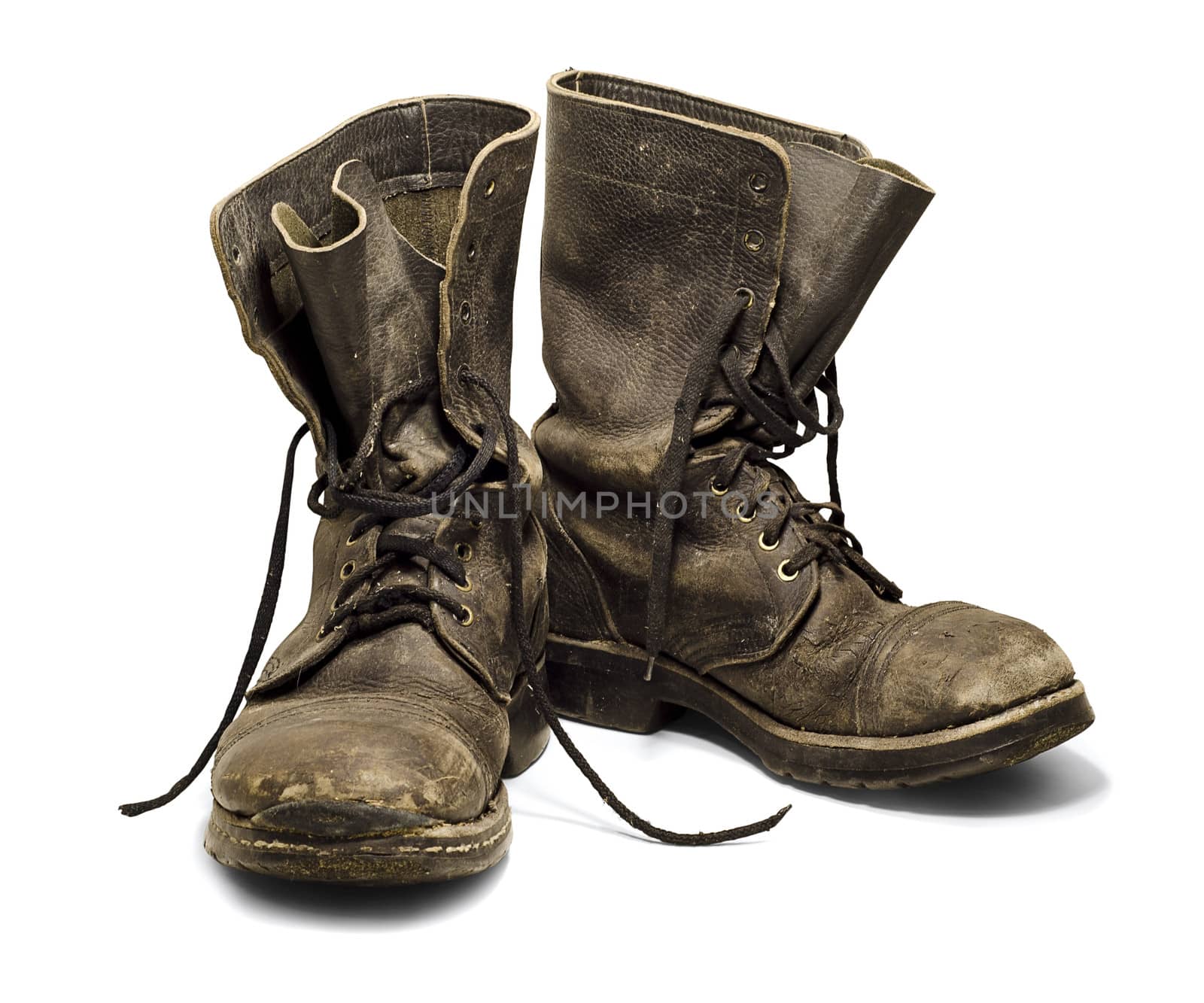 Old and dirty military boots isolated on white background