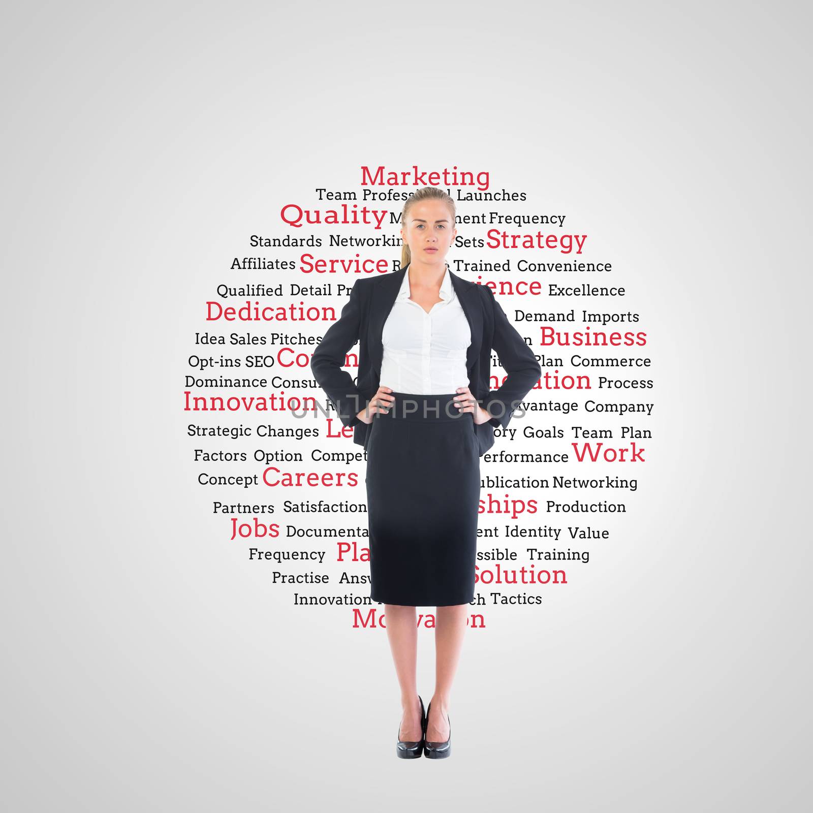 Composite image of businesswoman standing with hands on hips by Wavebreakmedia