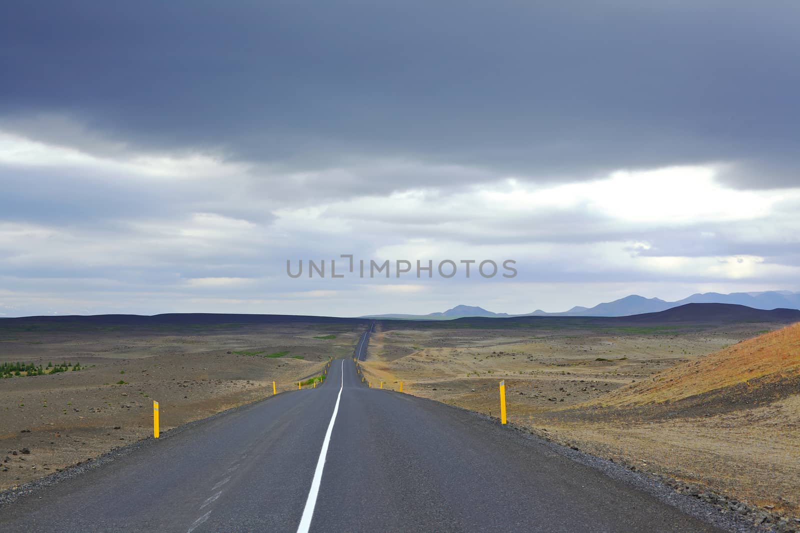 Highway through Iceland landscape at foggy day. Horizontal shot