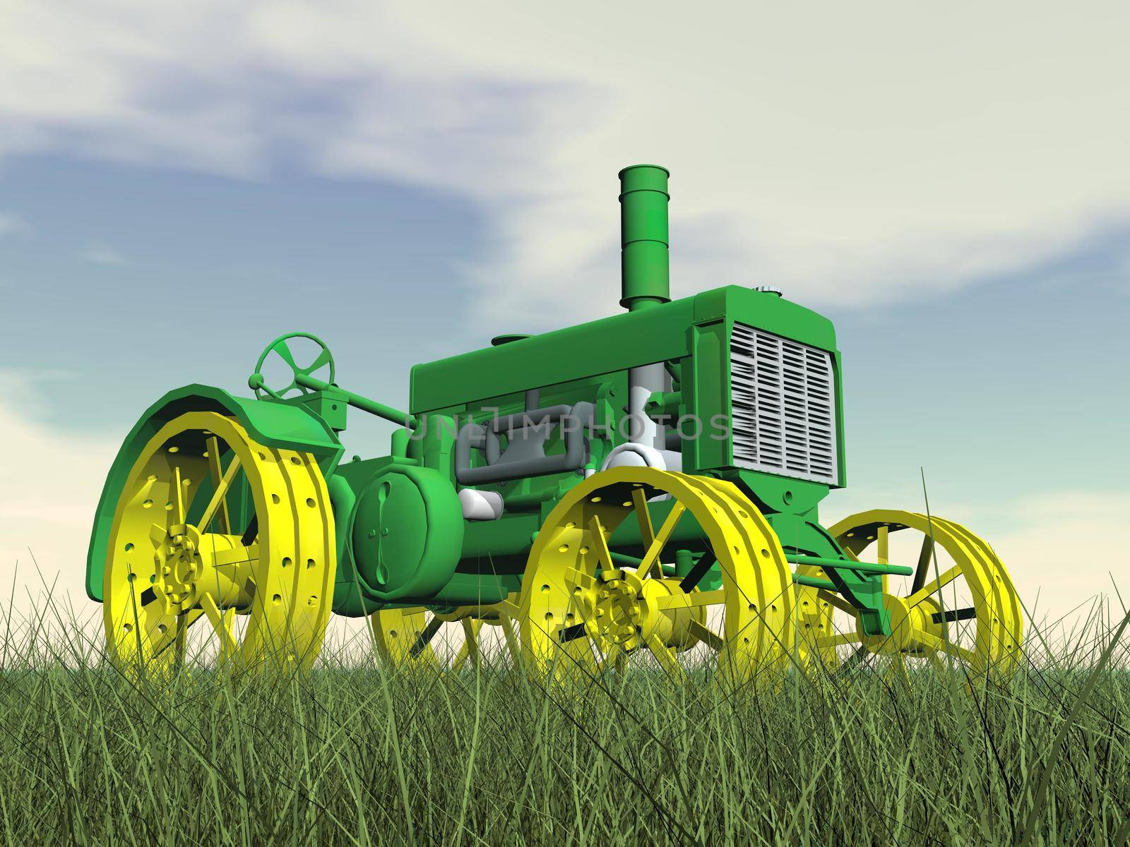 Close up of yellow and green antique tractor on grass by cloudy day