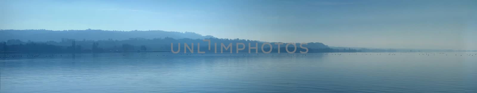 Panoramic view of Neuchatel lake by beautiful blue day, Switzerland