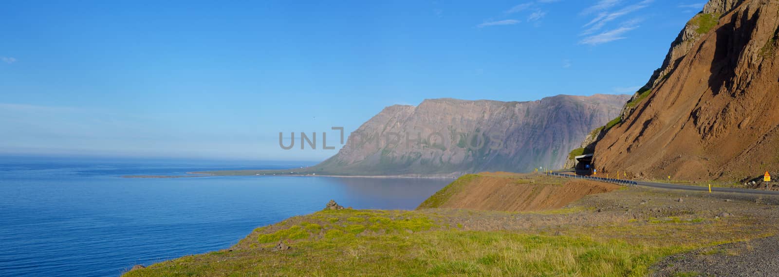 Iceland summer landscape. Fjord, house, mountains. Panorama.