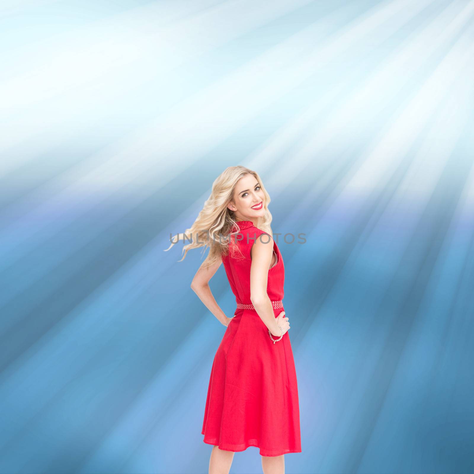 Composite image of smiling blonde turning by Wavebreakmedia