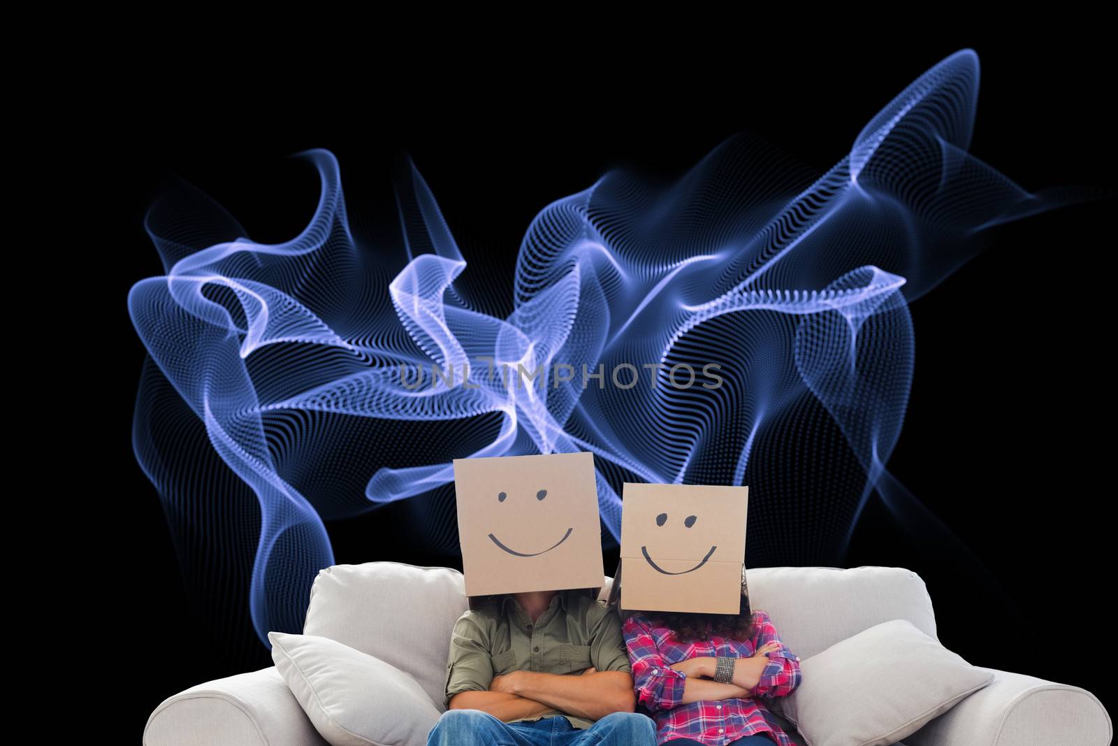 Composite image of silly employees with arms folded wearing boxes on their heads with smiley faces on a couch