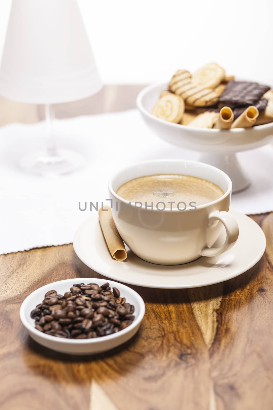 A cup of coffee on a wooden background