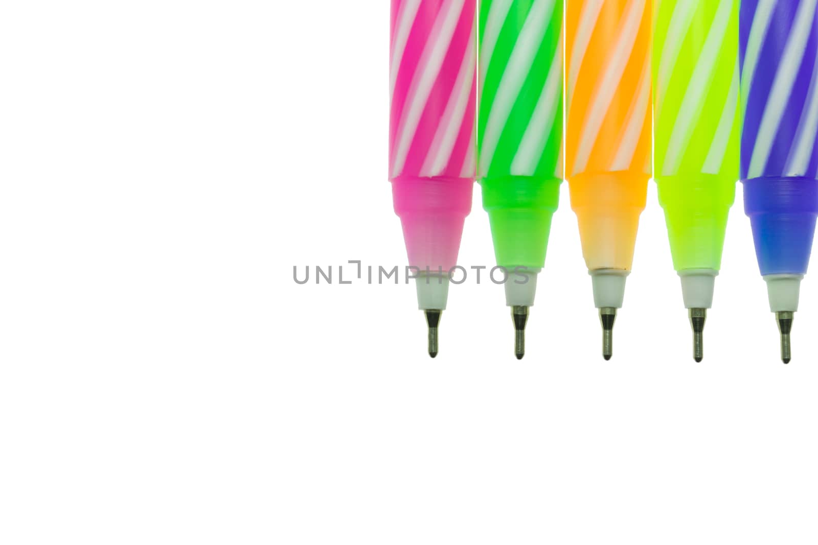 Five color pen on white background with soft light. The spiral pattern on 5 color pen.