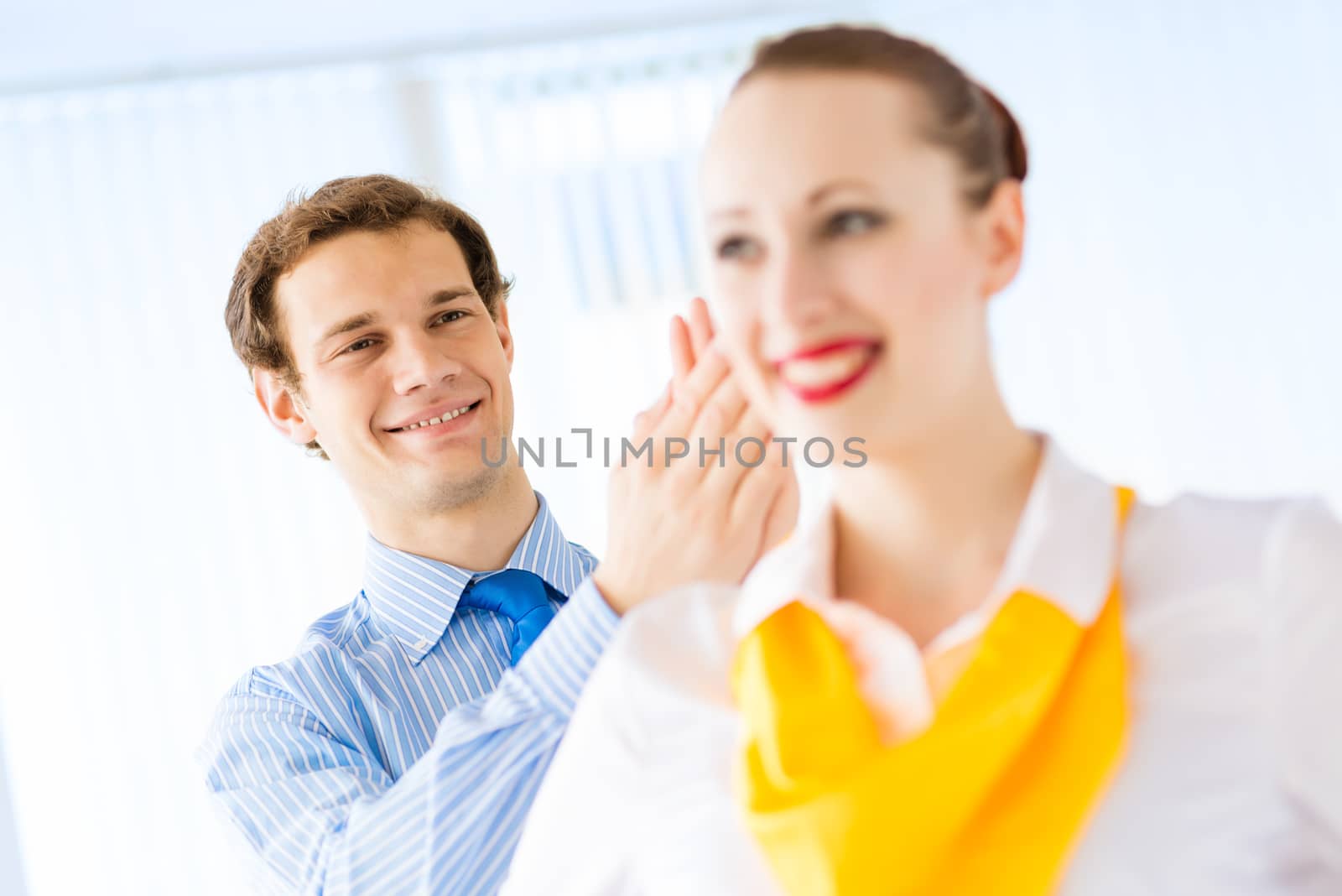 young successful business woman receiving congratulations from his colleagues