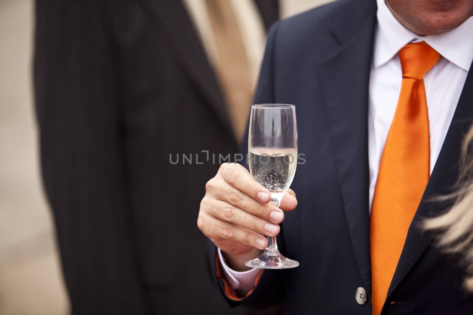 Businessman drinking champagne at a party