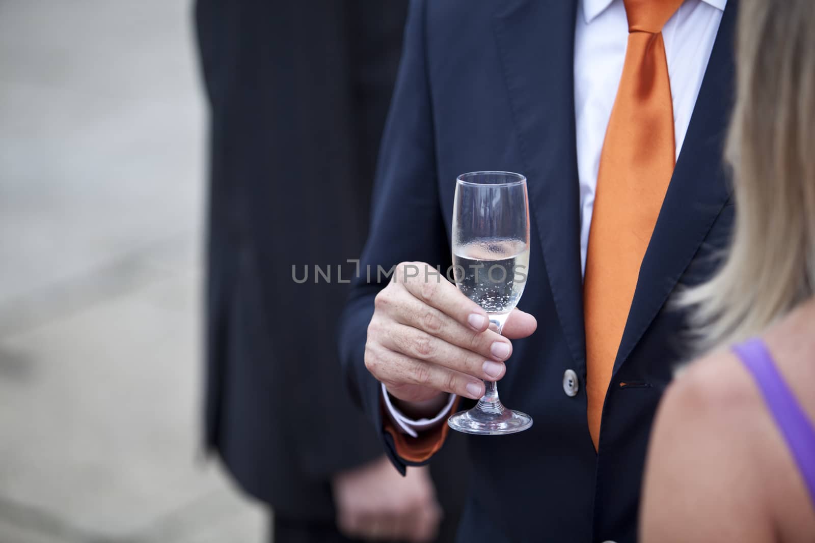 Businessman drinking champagne at a party