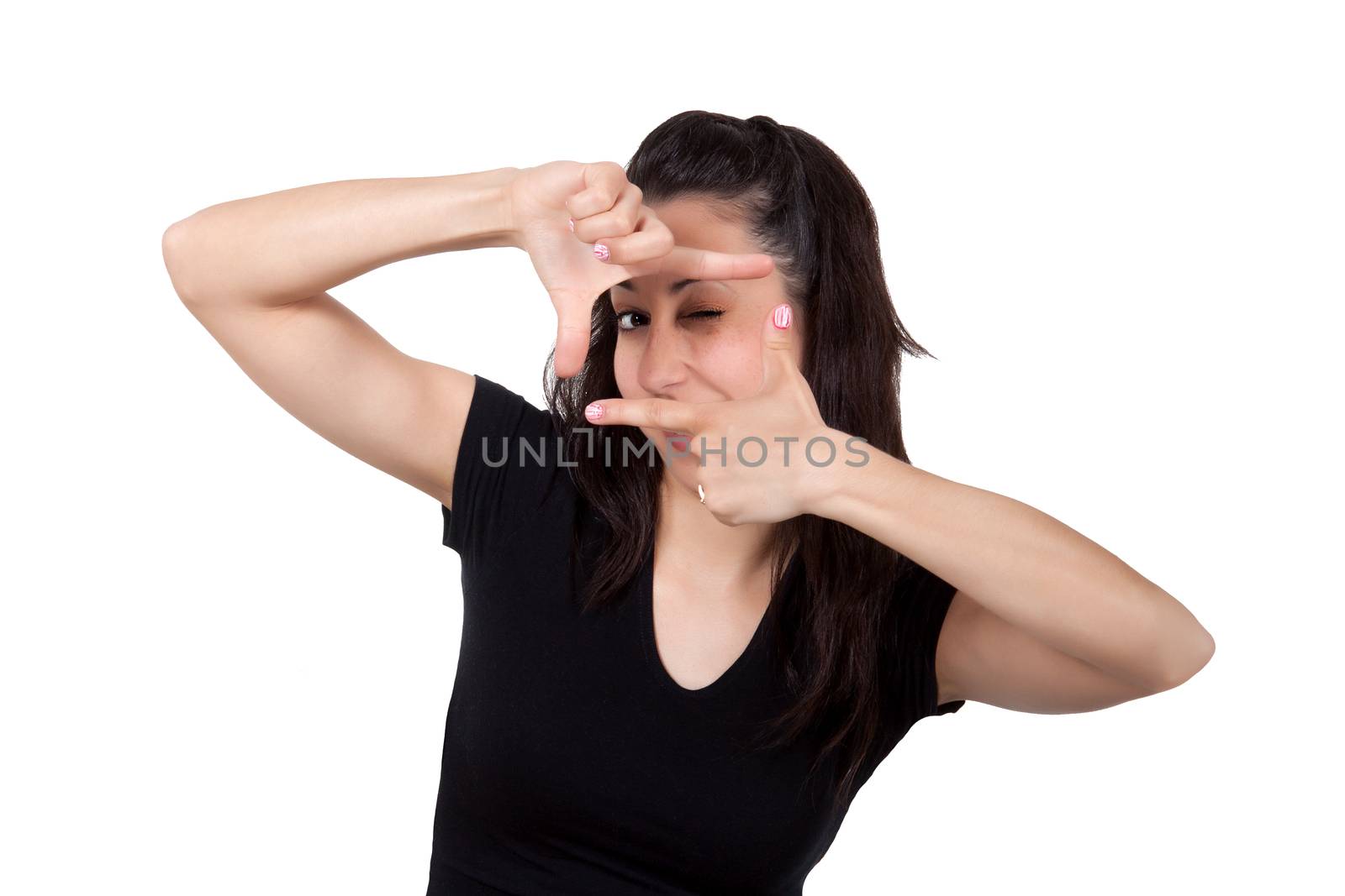 Portrait of young woman creates a frame with her hands, isolated on white background 