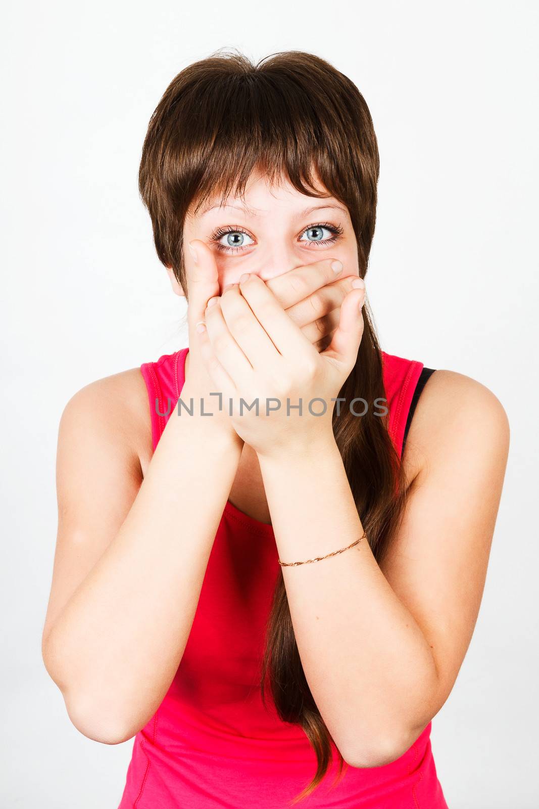 Young girl being gagged with his own hands