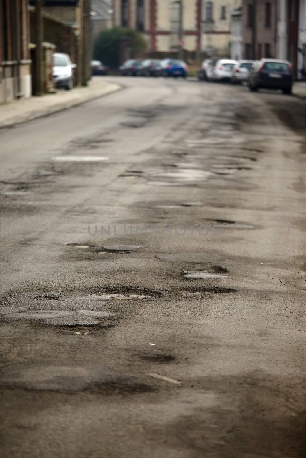 Very bad quality road with potholes