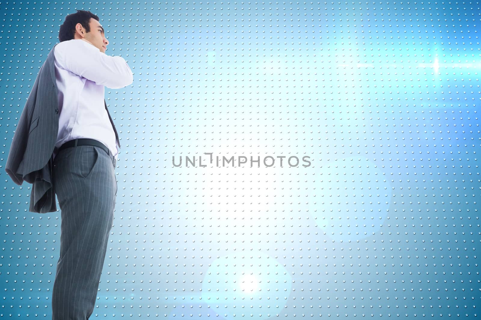 Composite image of unsmiling businessman standing by Wavebreakmedia