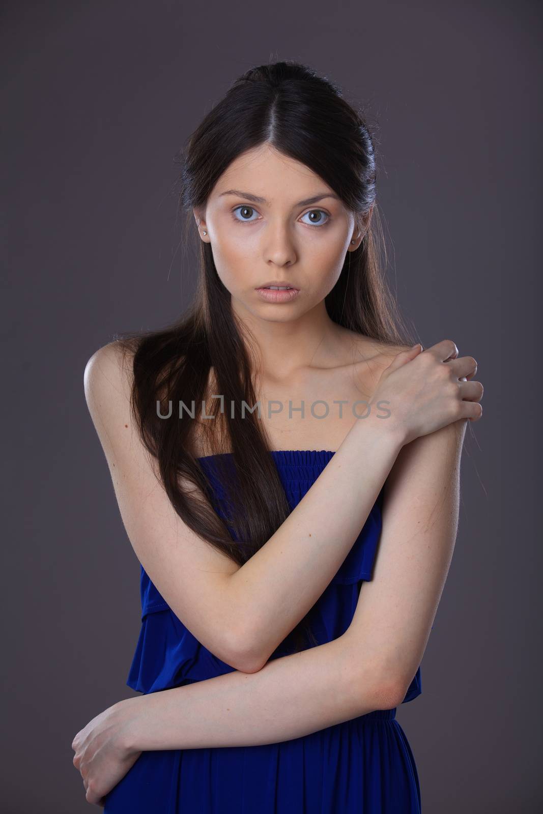 Glamour portrait of beautiful woman model with fresh daily makeup and romantic hairstyle.