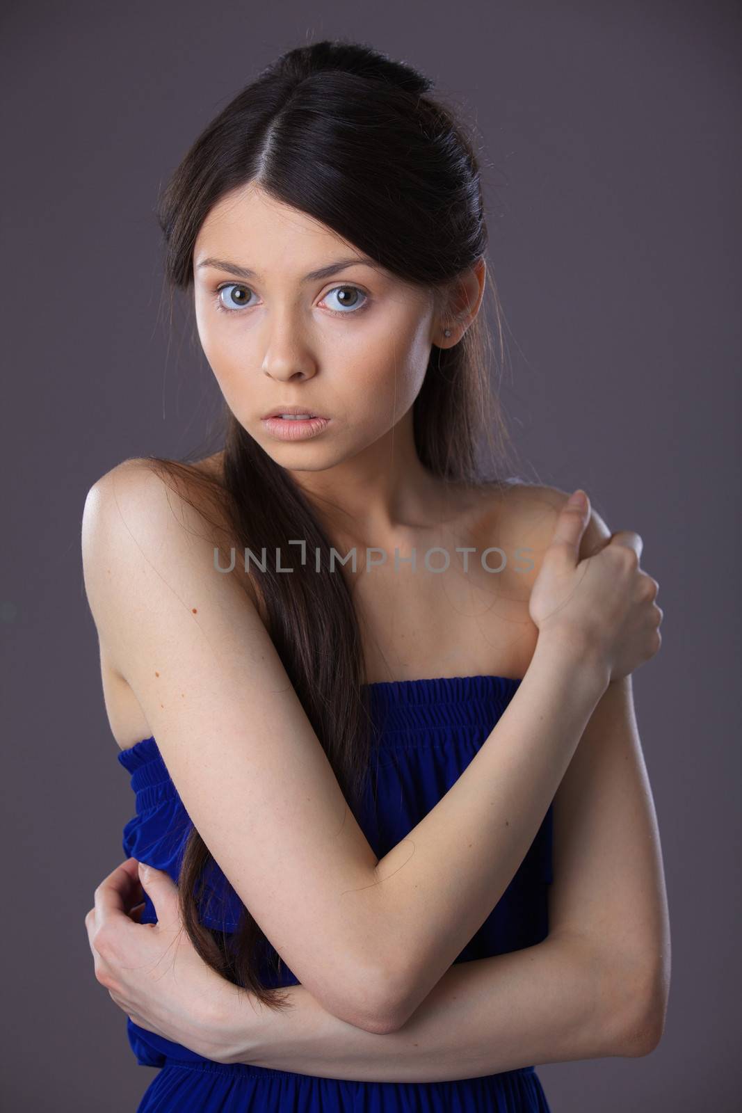 Glamour portrait of beautiful woman model with fresh daily makeup and romantic hairstyle.