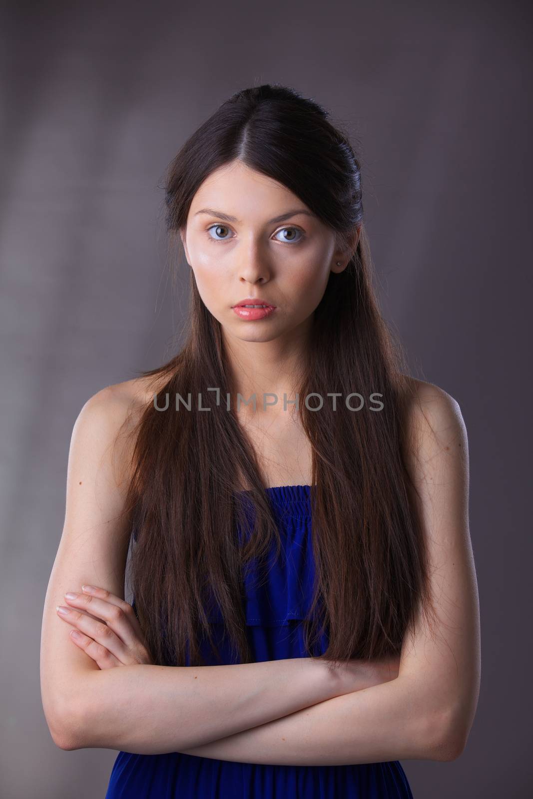 Glamour portrait of beautiful woman model with fresh daily makeup and romantic hairstyle.