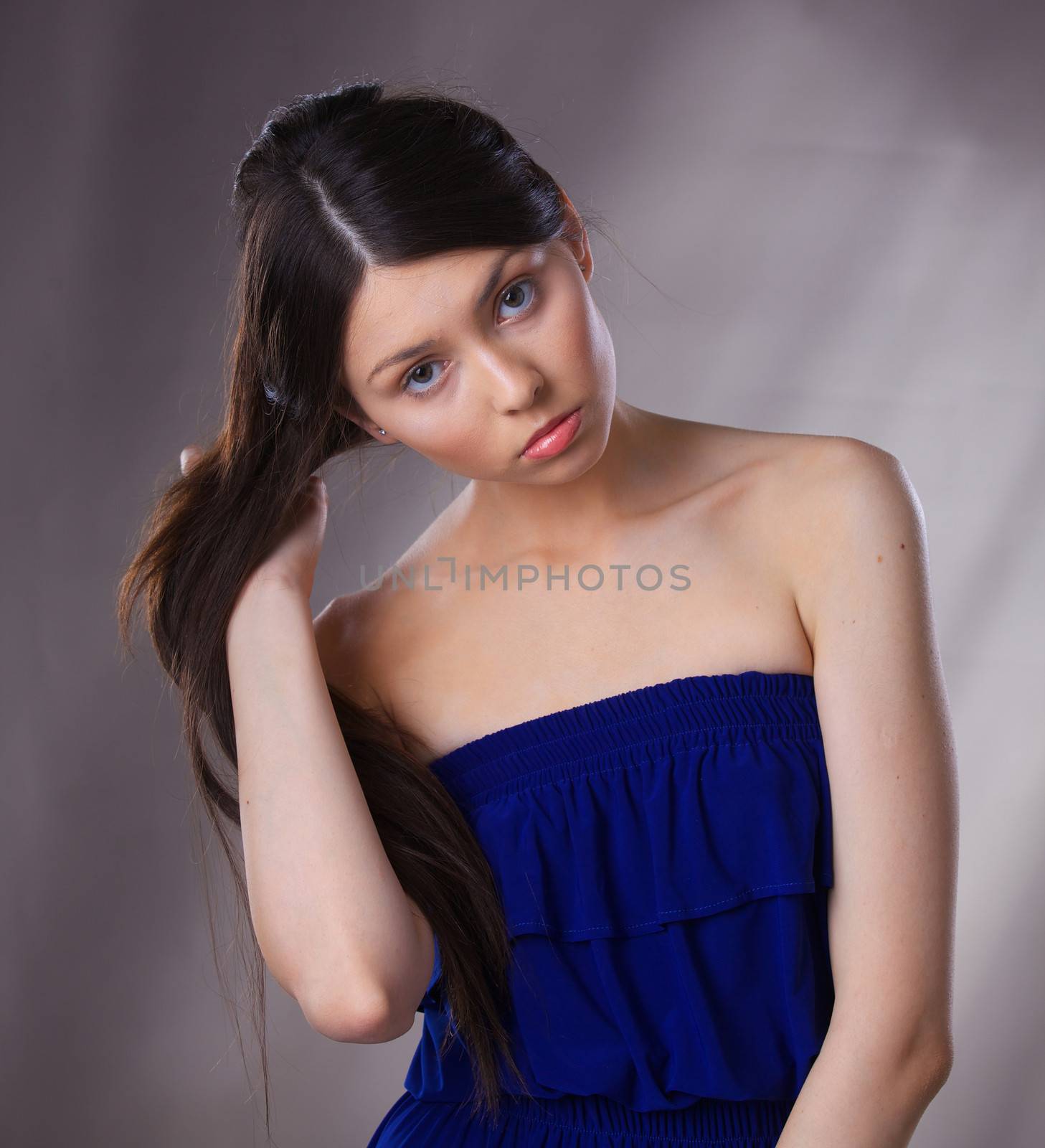 Glamour portrait of beautiful woman model with fresh daily makeup and romantic hairstyle.