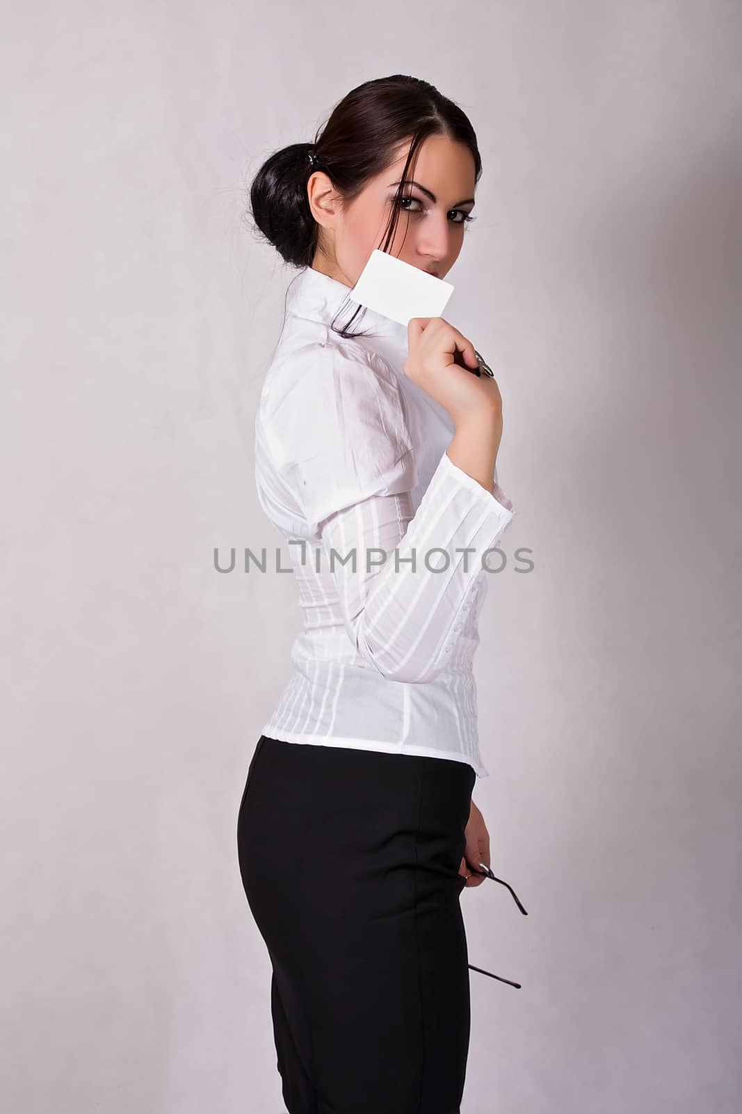 portrait of young business woman holding credit card