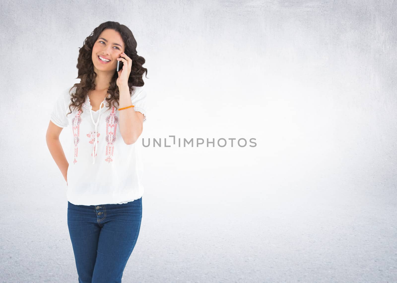 Composite image of attractive casual brunette having phone call by Wavebreakmedia