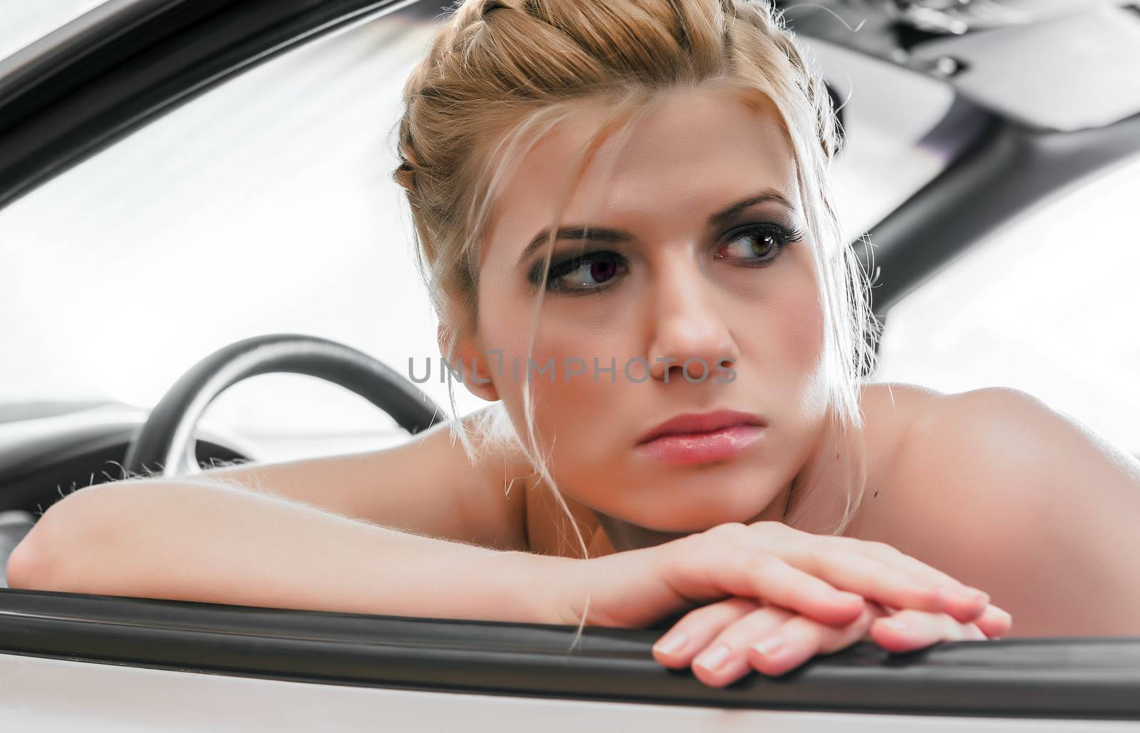 Young Woman Sat In The Drivers Seat of Her Car by vladimir_sklyarov