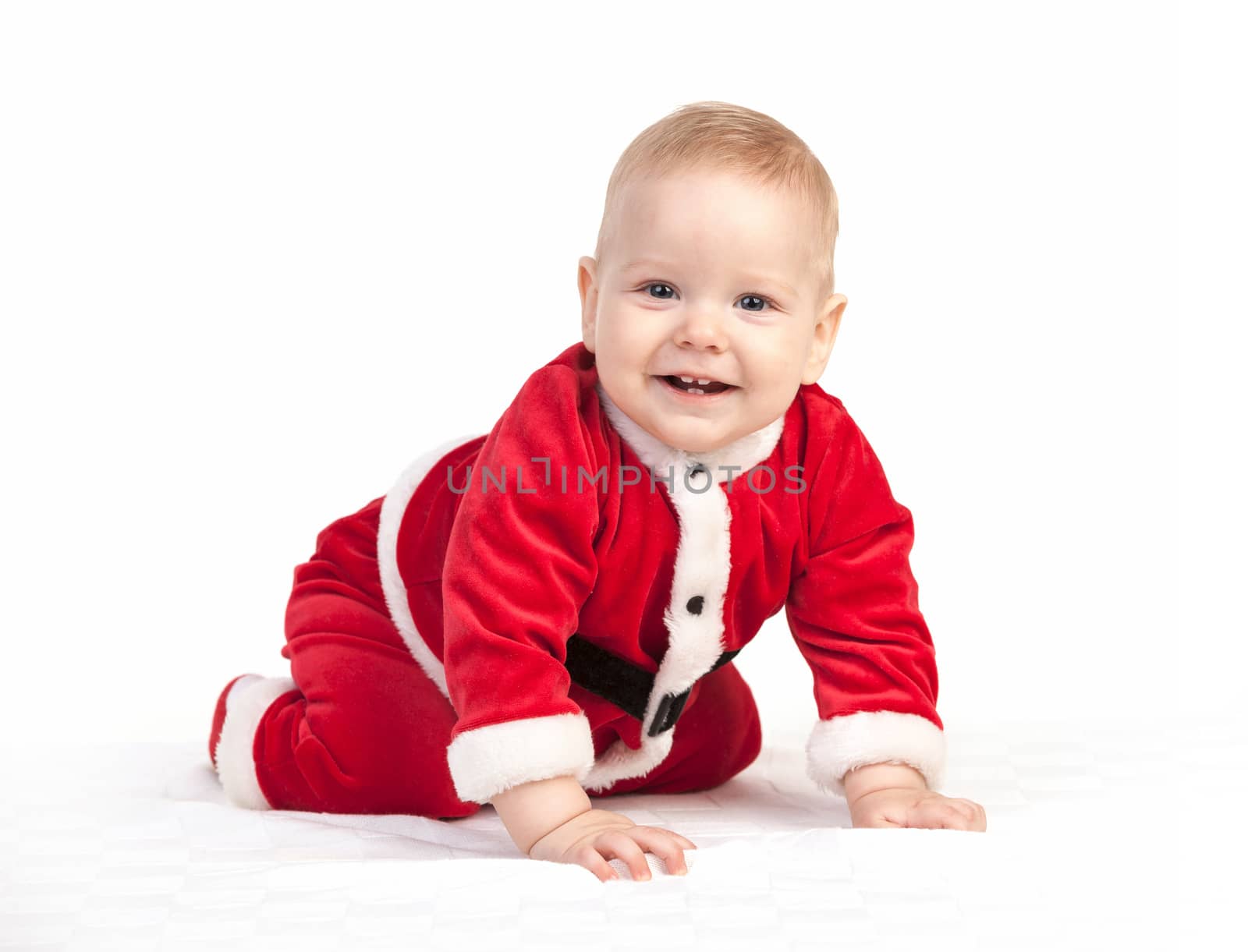 Happy little baby boy in Santa costume by photobac
