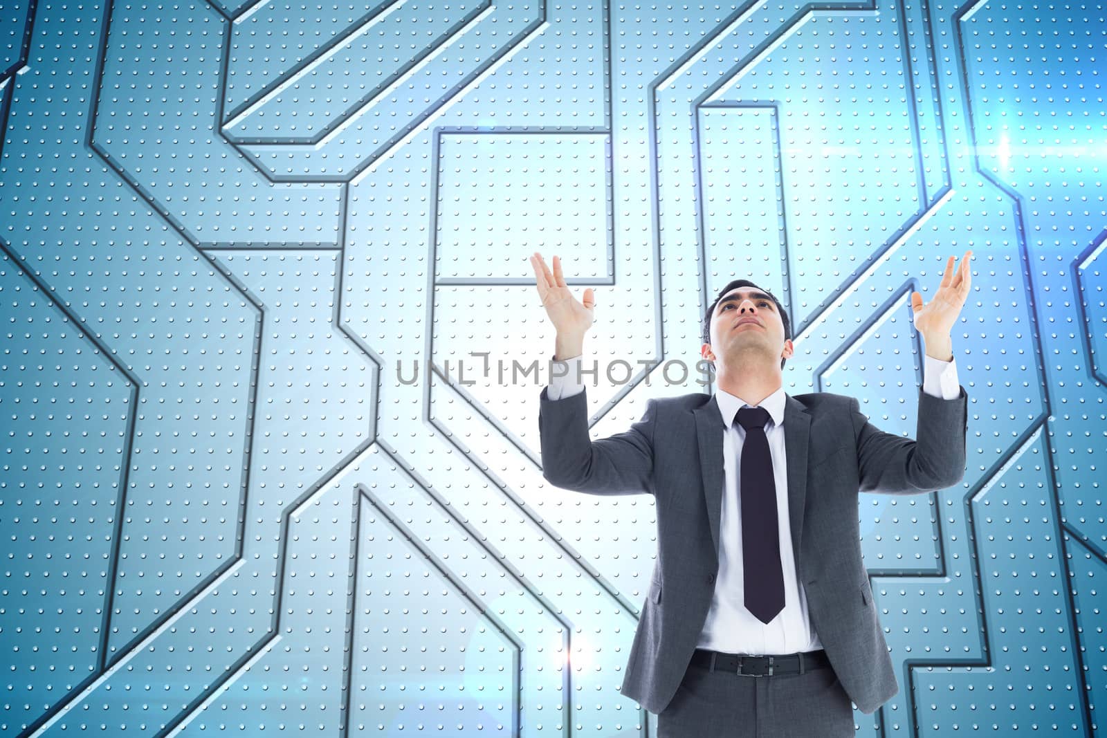 Composite image of unsmiling businessman with arms raised