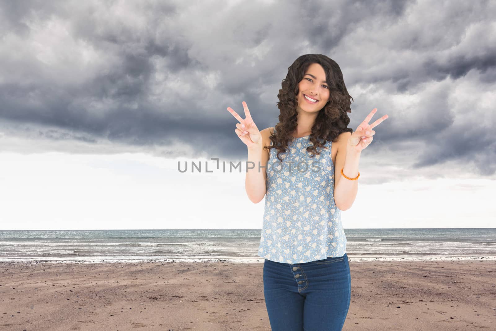 Composite image of smiling attractive brunette posing by Wavebreakmedia